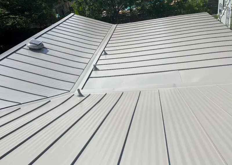 Solar attic fan installed on a metal roof for Roof Ventilation in Signal Mountain
